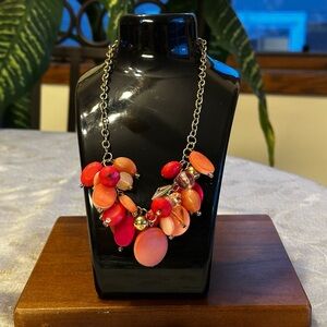 Pink shell smooth beaded necklace on silver tone chain